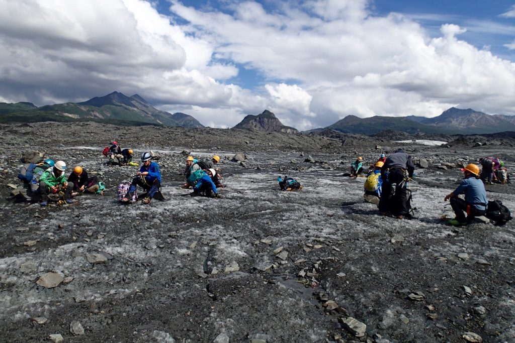 A group taking it more serious and getting ready to climb the glacier.