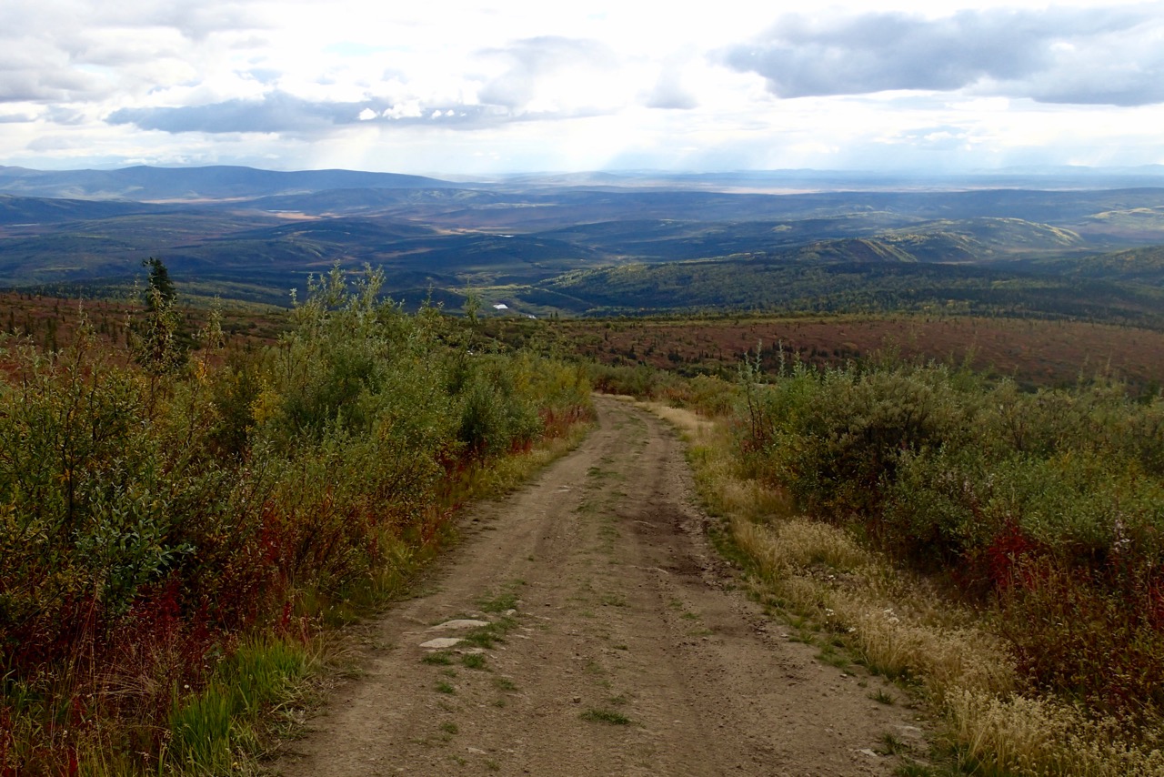 Riding up to a mountain in Canada on the four-wheeler
