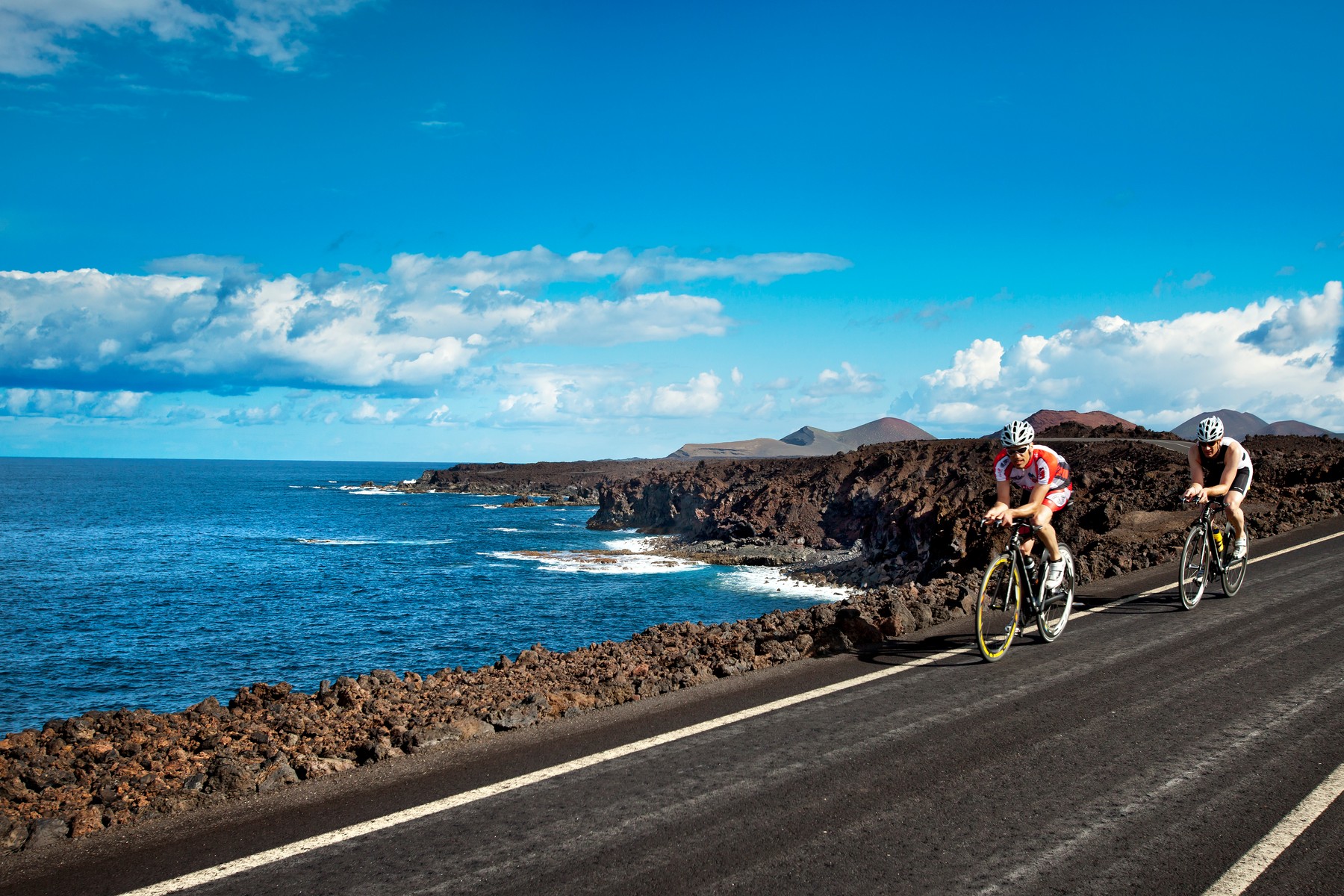 Cyclists at cliff coast, Los Hervideros, Lanzarote, Canary Islands, Spain, Europe, Image: 151243631, License: Rights-managed, Restrictions: , Model Release: no, Credit line: Profimedia, LOOK-foto