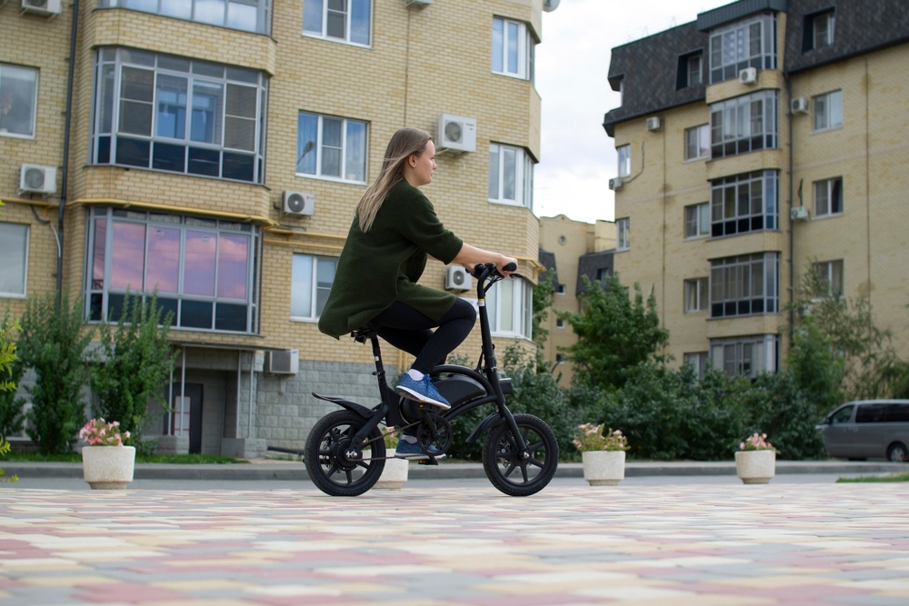 Woman Riding E-Bicycle