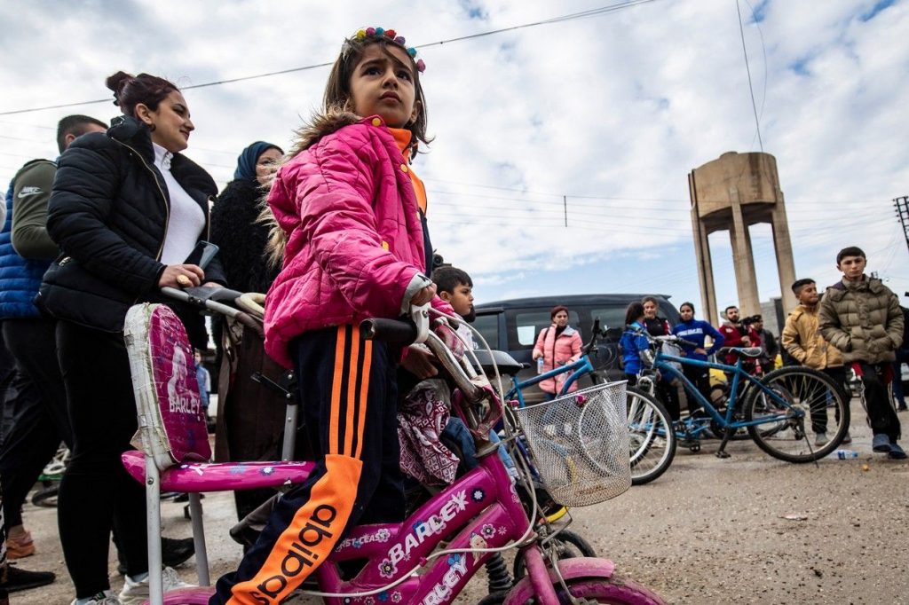 Little girl with a bicycle